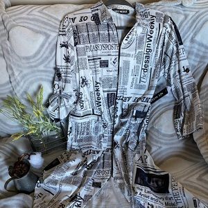Zip-up 3/4 length, newspaper print fashion sweater
